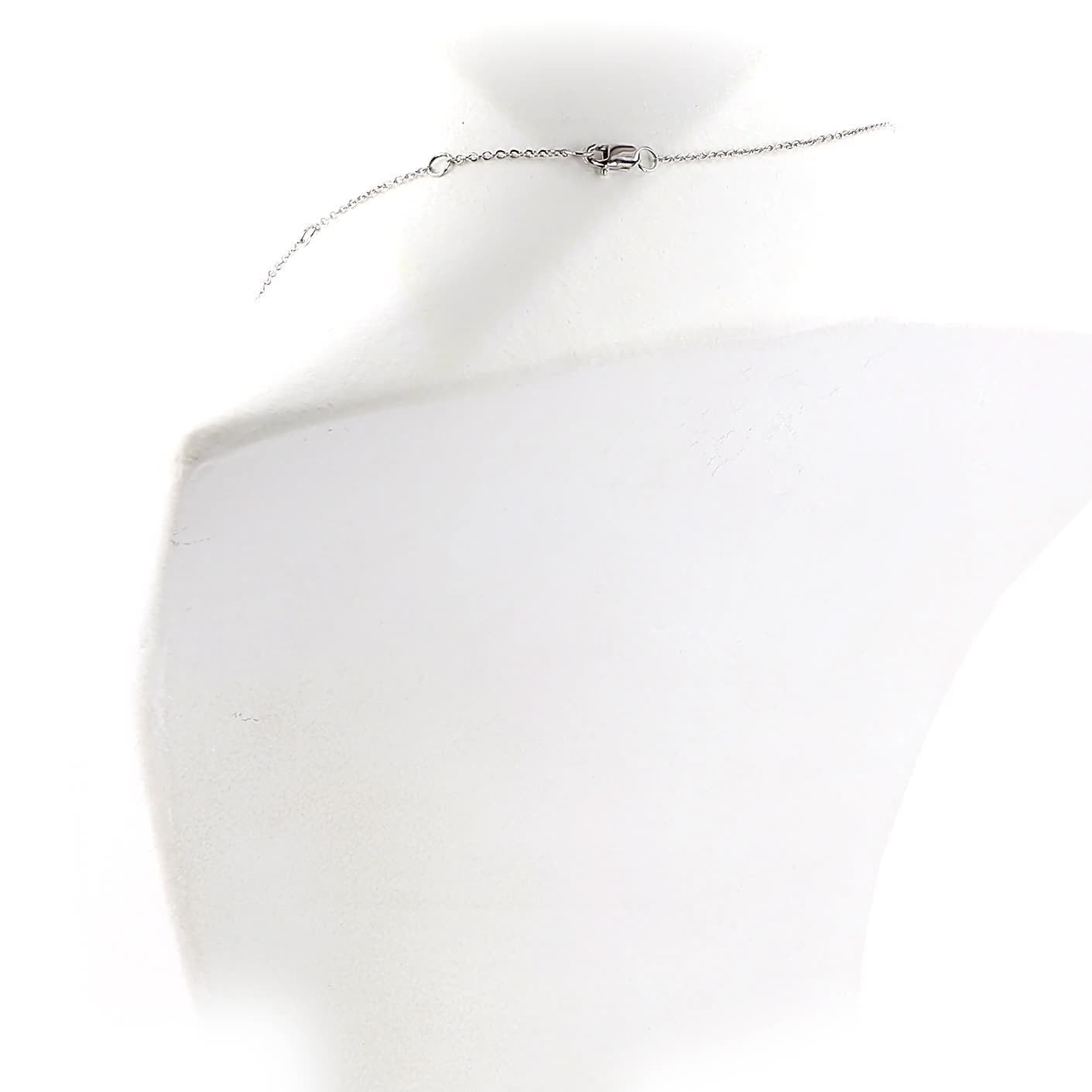 Diamond necklace on a white mannequin with a white background