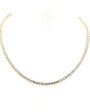 Gold necklace with small diamonds on a white background