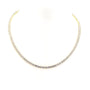 Gold necklace with small diamonds on a white background