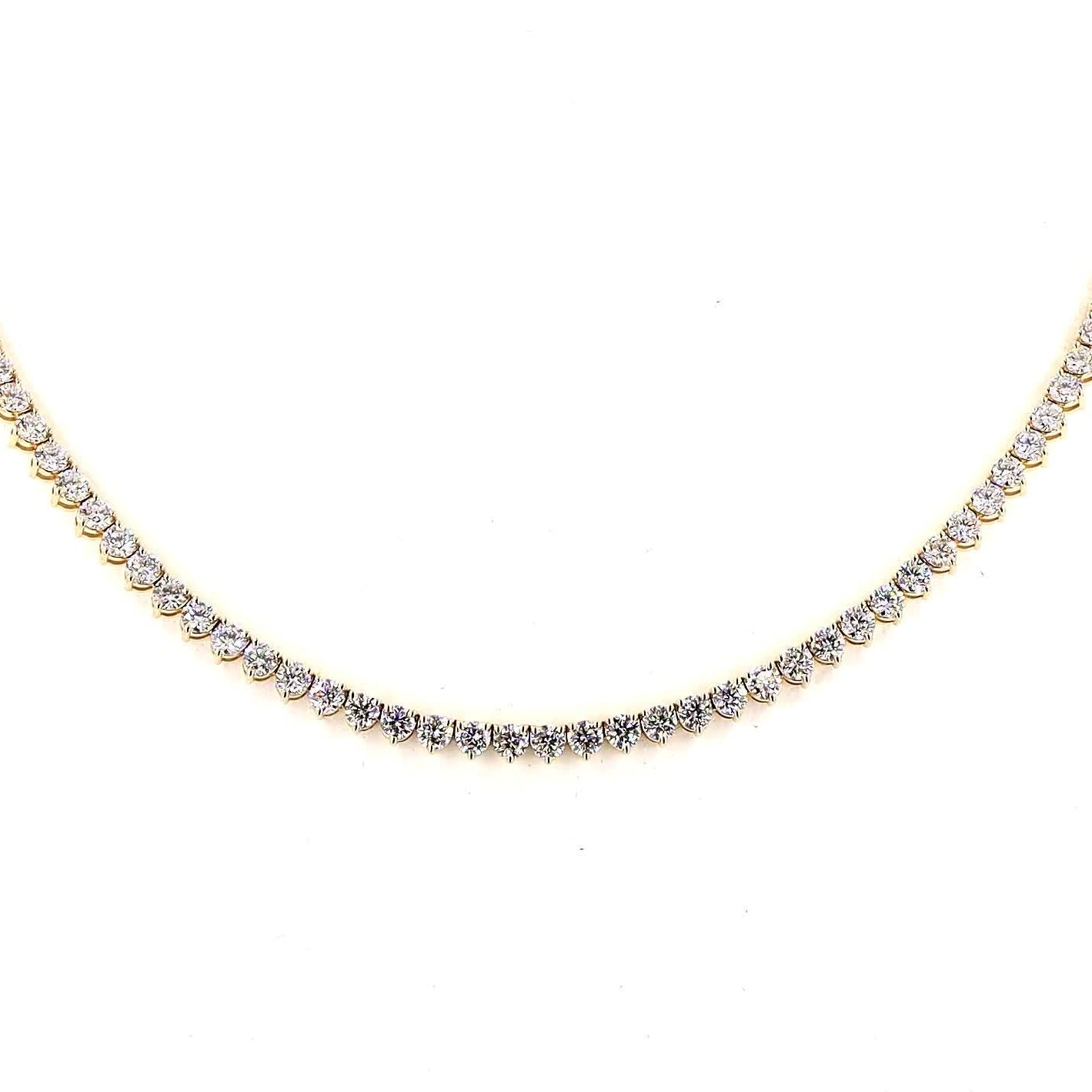 Gold necklace with diamonds on a white background