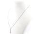 Diamond necklace with a teardrop-shaped pendant on a white background