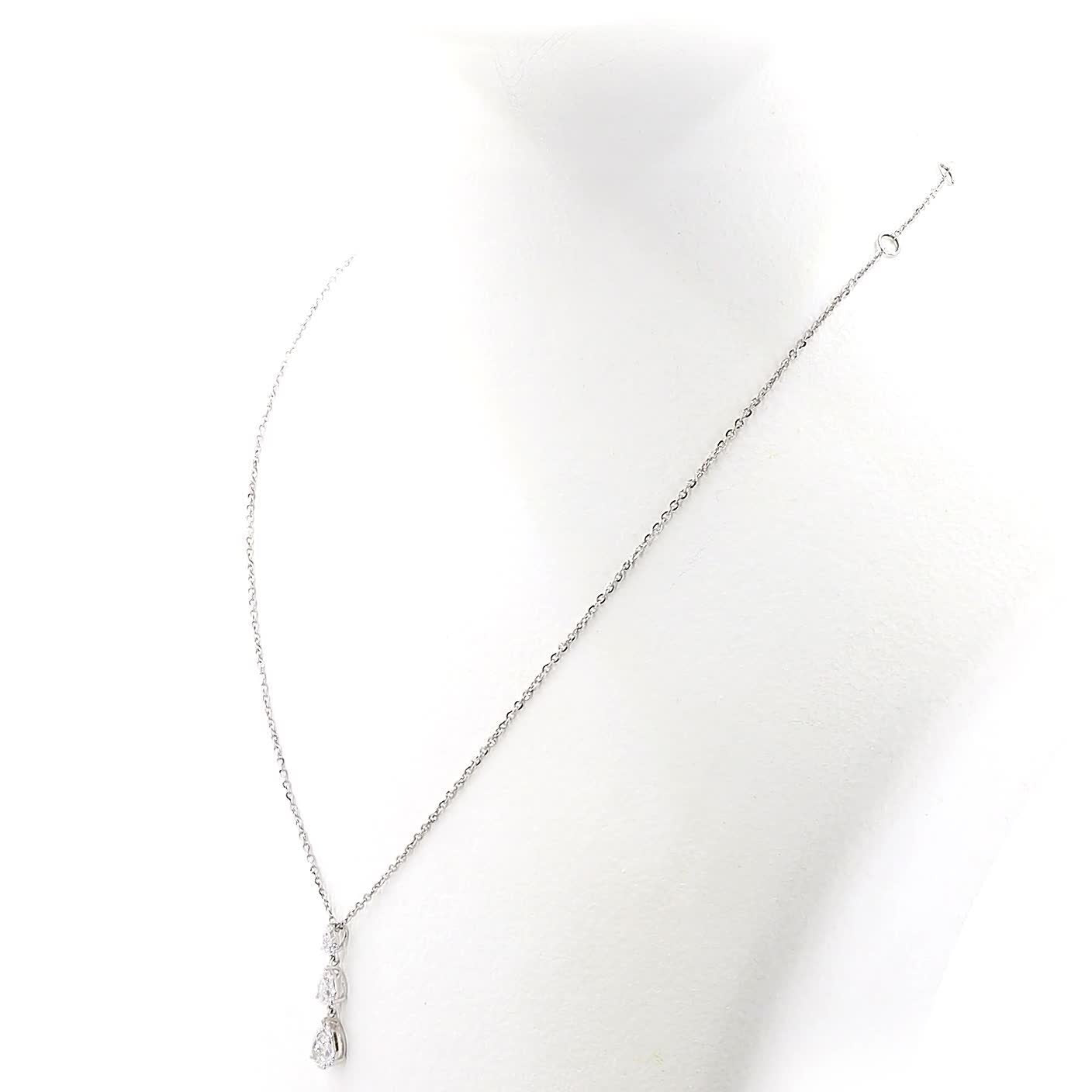 Diamond necklace with a teardrop-shaped pendant on a white background
