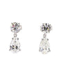 Pair of teardrop-shaped diamond earrings on a white background